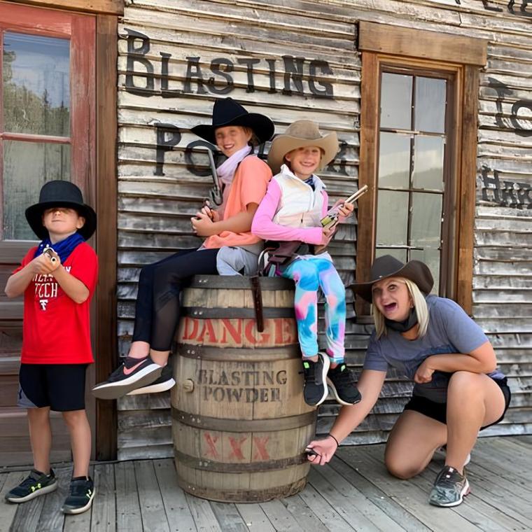 a group of kids posing for the camera with country boy mine in breckenridge, colorado