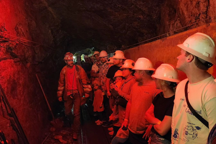 a group of people standing around a fire