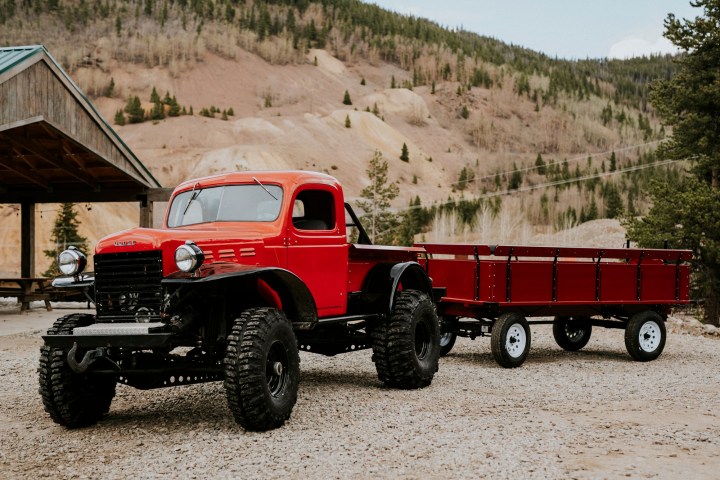 a truck driving down a dirt road